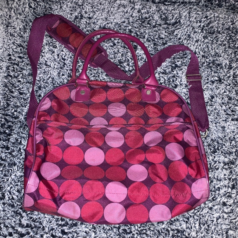 Matching travel bag with suitcase.